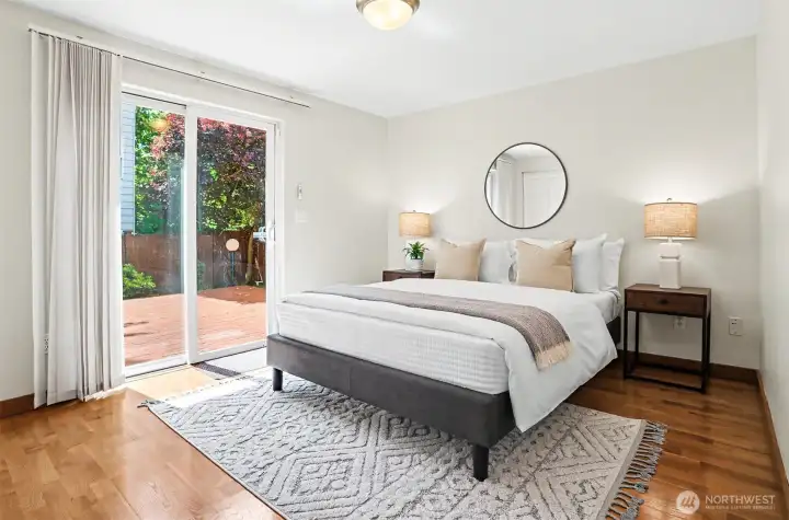 One of two bedrooms on the first floor. Spacious, bright and access to a fully-fenced back yard.