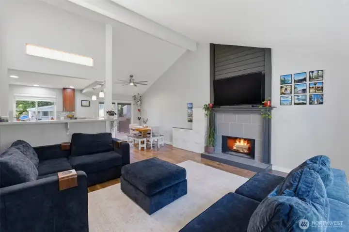 Wood burning fireplace sets a cozy spot for gathering.