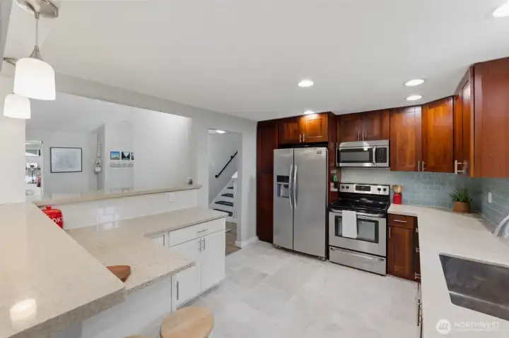 Popular two tone kitchen with newer appliances, cabinets and quartz counters.