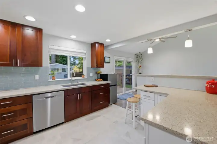 Updated kitchen with shaker cabinets and quartz counters.