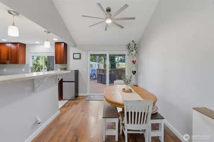 Dining area leads to the backyard space.