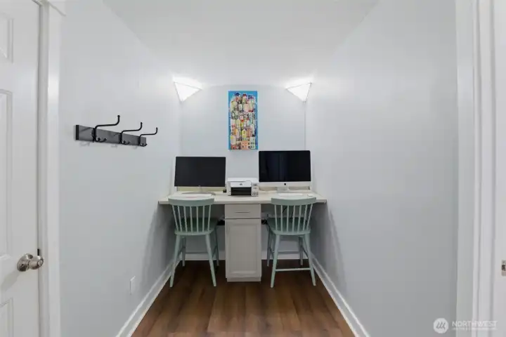 Lower level features this separated study/workspace, garage access, laundy and two bedroom/flex rooms.
