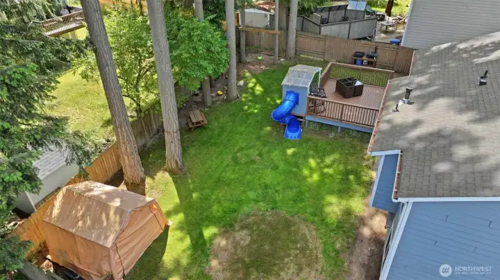 Roomy, fully fenced backyard with a large deck means space to play, entertain and relax.