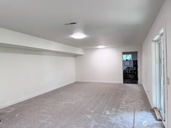lower level family room with new carpet & paint