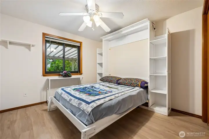 Versatile bedroom with a Murphy bed that can convey with the sale at the buyer's preference.