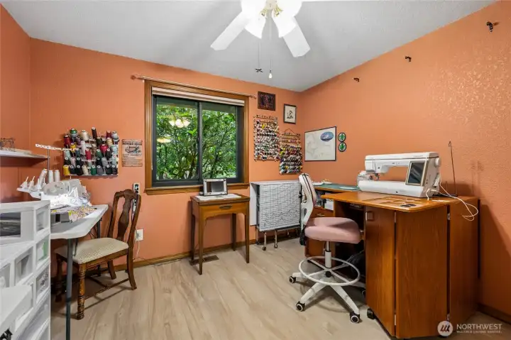 Front-facing bedroom overlooking the landscaped front yard.