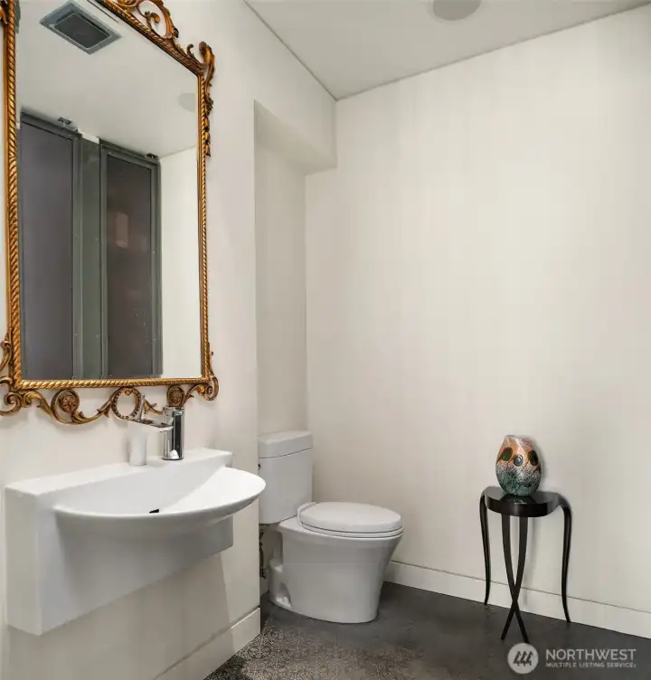 Main level powder room with shower. Main level powder room with shower.
