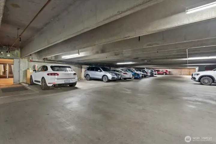 Private, secure garage. Level 2 EV charger available.  Unit comes with one space, additional space(s) are an option.