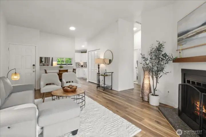 Open concept kitchen to living area with cozy fireplace Open concept kitchen to living area with cozy fireplace