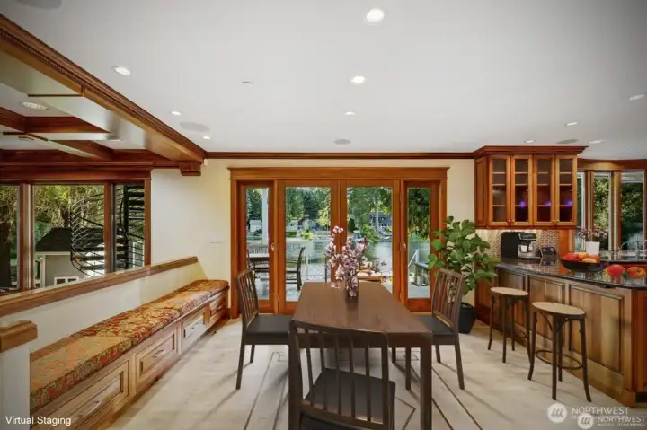 Eating Bar, kitchen dining area with French doors opening to patio and lake. Sidelight windows open up for fresh air. Eating Bar, kitchen dining area with French doors opening to patio and lake. Sidelight windows open up for fresh air.