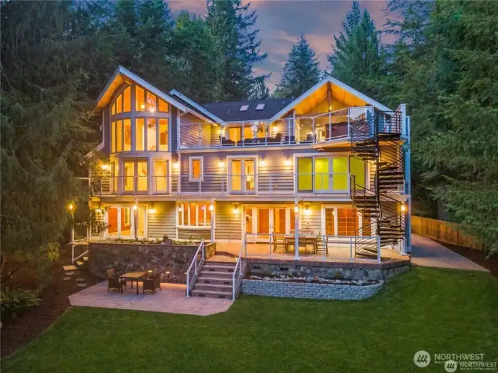 Enjoy all four levels looking out to the lake while listening to the whole home Audio System on every level. Enjoy all four levels looking out to the lake while listening to the whole home Audio System on every level.