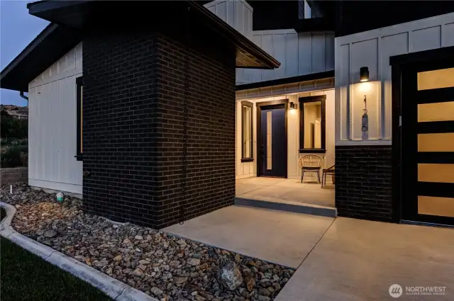 Private front patio with gorgeous brick accent