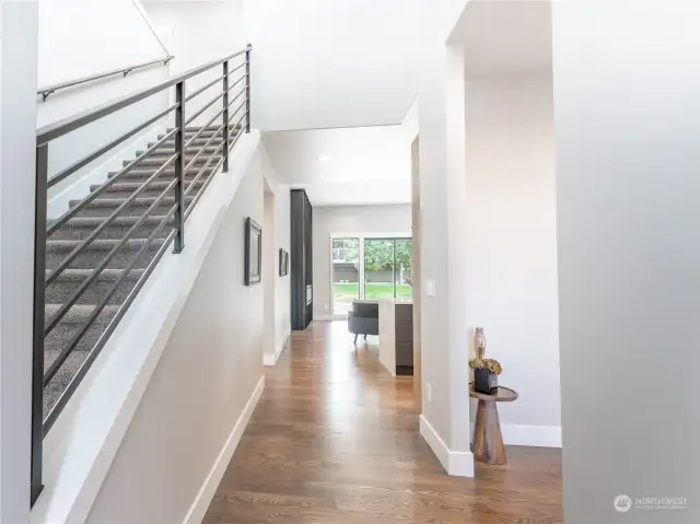 Gleaming real hard wood floors greet you and flow