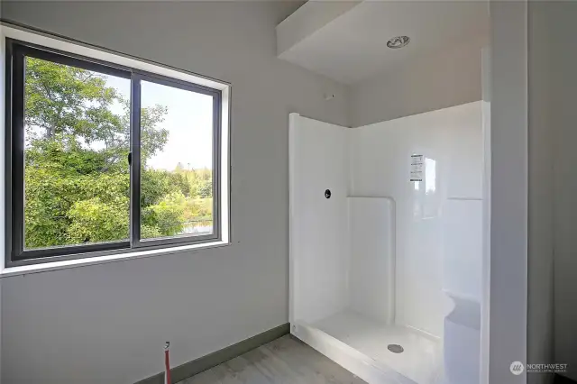 You can see the plumbing for the soaking tub and even a view of the lake to enjoy!