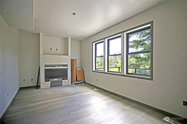 Large windows fill the living room with of a plenty natural light so no matter what time of the year it is, this room should always feel light and bright.