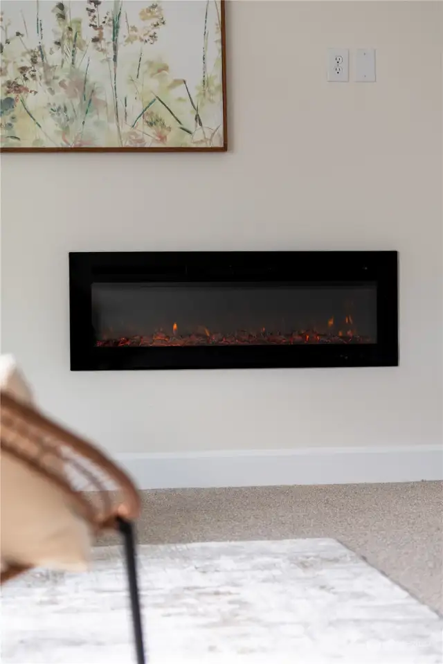 Electric fireplace has settings for heat and ambiance only modes