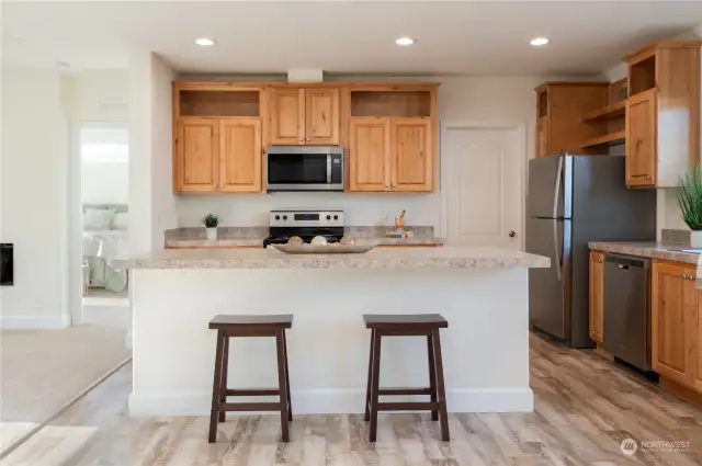 Island counter seating in this spacious kitchen