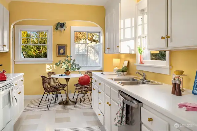 The sweetest kitchen, sunny and bright with a breakfast room that is the perfect place to start your day.