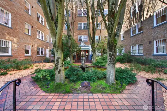 Wonderful courtyard entry with fountain and landscaping.