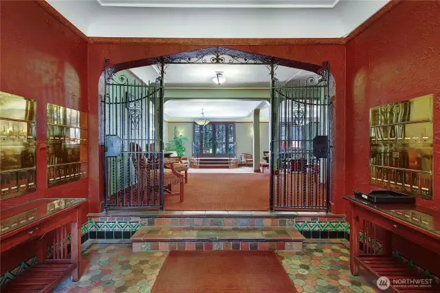 Welcoming lobby entrance. Beautiful period details. French doors lead to back community deck and parklike grounds.