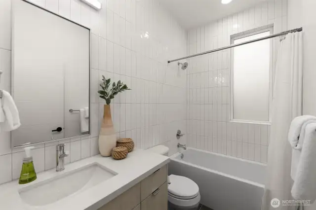 Fully Tiled Surrounds on Common Bathroom.