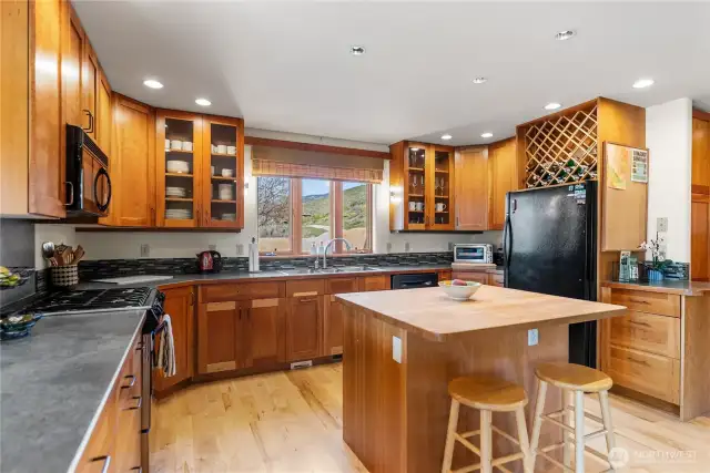 Maple countertops and extensive counters allow for multiple cooks and many projects! MOuntain views from kicthen sink!