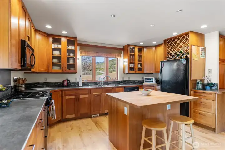 Maple countertops and extensive counters allow for multiple cooks and many projects! MOuntain views from kicthen sink!