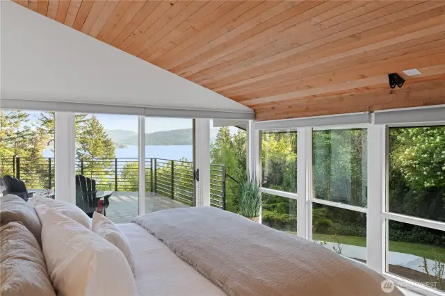 One of two primary suites, this one has a stunning lake view and access to the large deck.