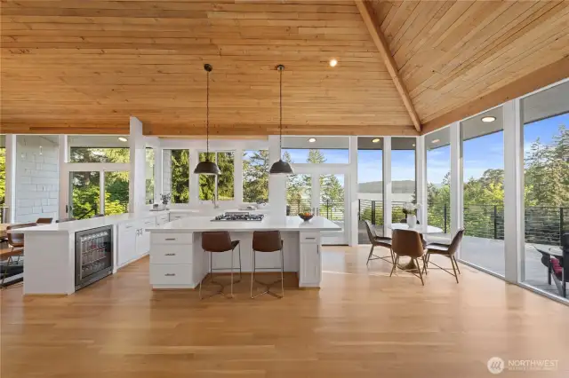 Beautiful hardwood floors and walls of windows looking to the lake give a coastal contemporary elegance to the home.