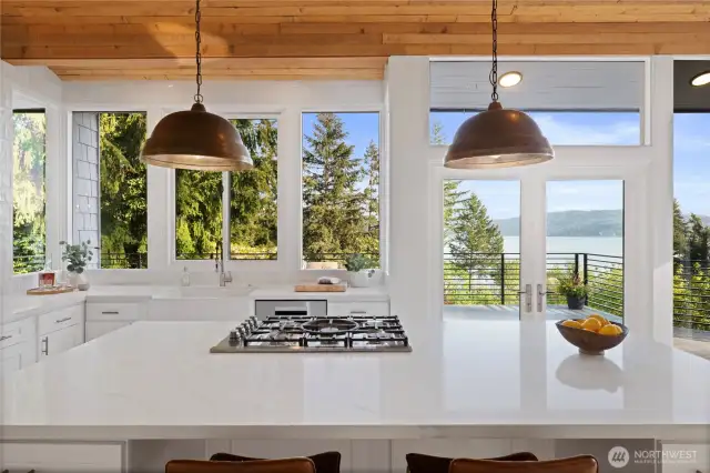 Quartz countertops and chic lighting compliment the open and airy feel.