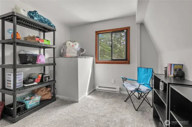 Flexible Bonus Room with Natural Light  Whether you need a craft space, home office, extra bedroom, or reading retreat—this versatile upstairs room delivers. Featuring plush carpet, a large window overlooking the trees, and unique nooks for shelving or cozy corners, this space adapts to whatever life throws your way. A blank slate ready for your vision!