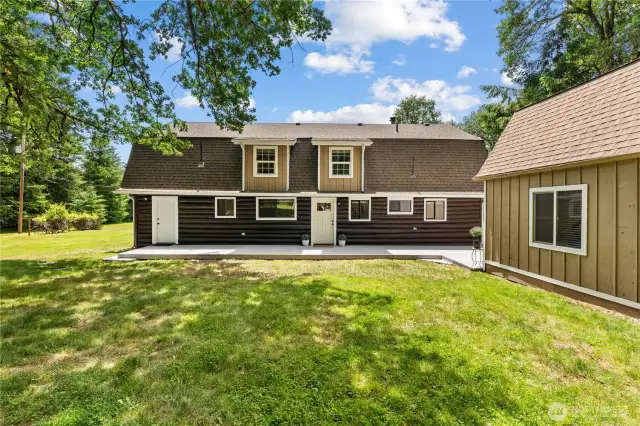 The Backside Beauty You Didn’t See Coming...  Not only does this home charm from the front, but the back is just as impressive! Freshly painted trim, new concrete patio space, and a fully refreshed look that blends rustic cabin vibes with modern upgrades.