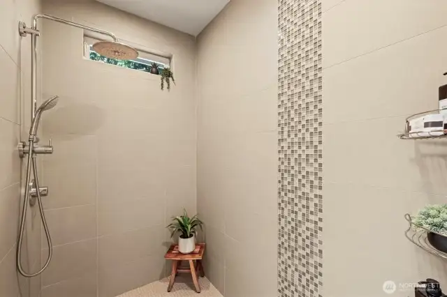 Back in the primary bathroom is this timeless tile shower!