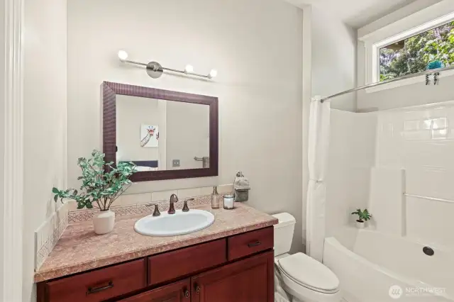 The updated lighting and large window above the shower provide excellent lighting!