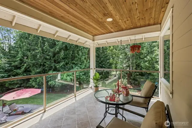 Off the upstairs living room is this covered deck!