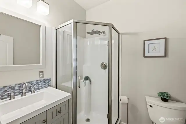 Efficient 3/4 bathroom off the upstairs primary bedroom.