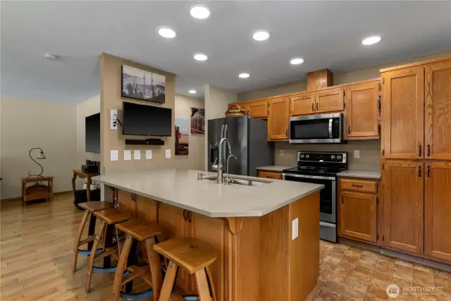 kitchen bar dining area.  Kitchen cabinets are equipped with pull out shelves for added convenience.