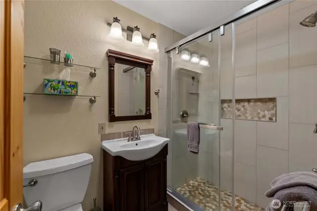 Bathroom off Primary Bedroom with a new tile double shower.