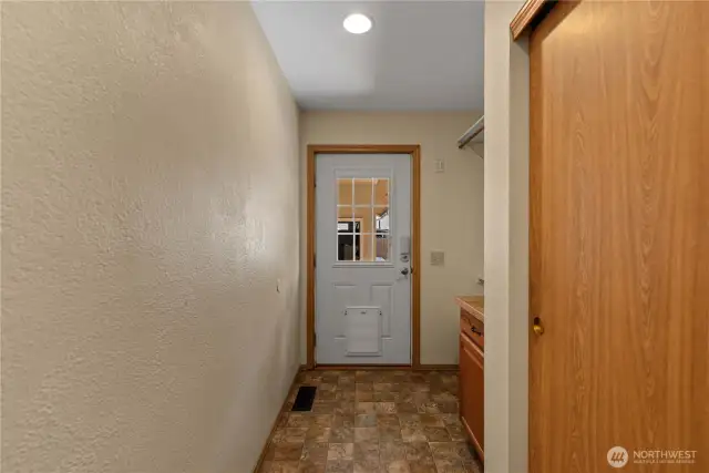 Mudroom leading to rear patio area and garages
