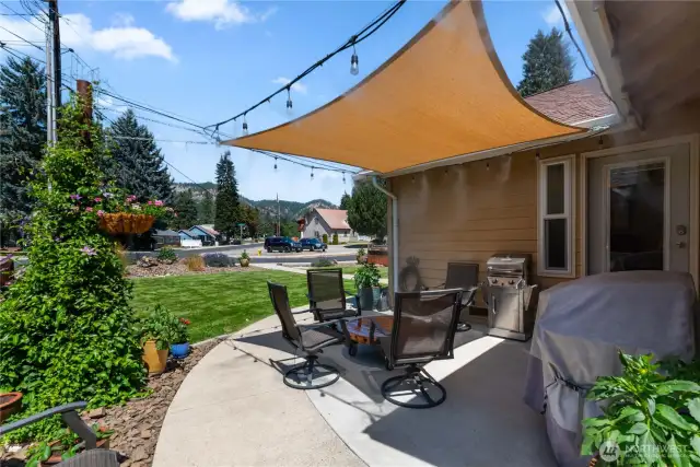 Front patio area with misting system and shade sail.