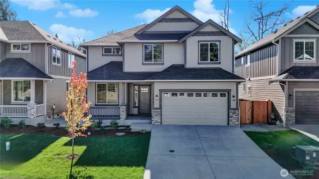 Beautifully designed new home from local, experienced northwest builder BI Homes, Inc. includes durable Hardi brand siding and accents, stone garage and post accents, an inviting front porch with energy efficient fiberglass entry door and vinyl clad windows.  Plus sod lawn with an included irrigation system.