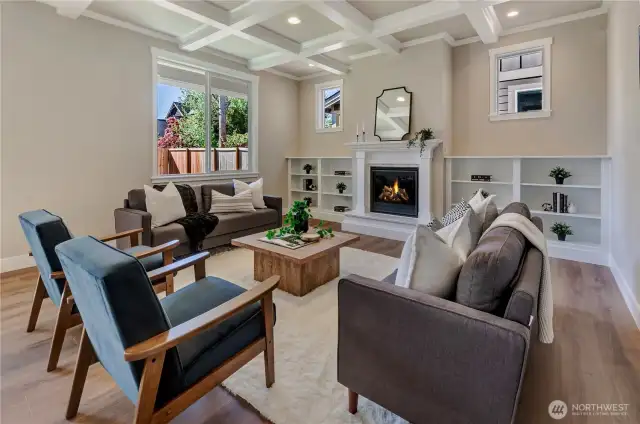 Spacious in size, this great room includes a natural gas log fireplace with custom painted mantle and bookshelves.