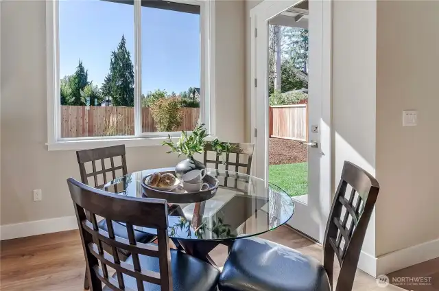 Located off the kitchen and next to the great room, is a spacious nook eating area with wonderful views of the rear landscaped, irrigated and fenced yard
