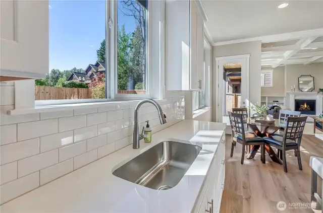 Our home buyers demand well-designed open rooms including our kitchens with large windows, solid quartz counters, a recessed stainless finish sink with easy to clean tile surround.