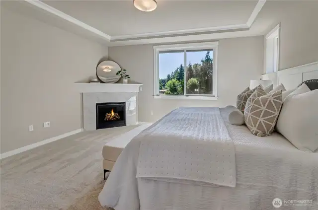 Note the coved ceiling in the primary bedroom with hand-painted crown moulding and trim. Light and airy