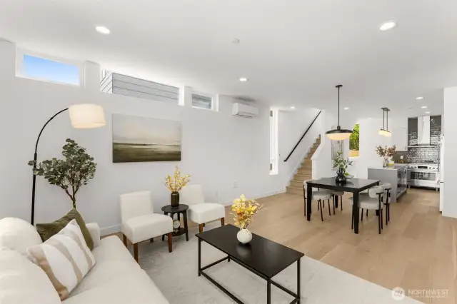 Open-concept layout connects the living and dining areas with ease and sophistication.