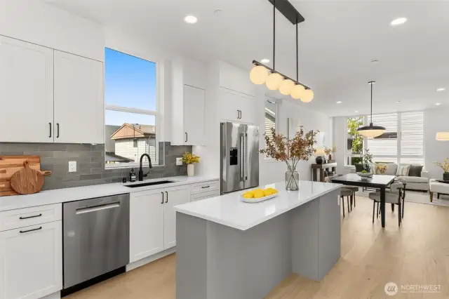Floating island anchors the kitchen, ideal for prepping, dining, or gathering with guests.