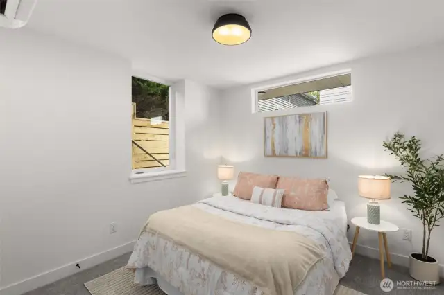 Ground-level bedroom with light-filled interiors and space to personalize.