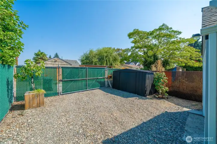 Automatic gate provides secure access to garage & carport. The garden shed is also helpful