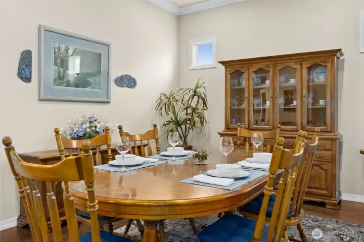 Formal dining has windows to covered patio